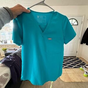 Several sets of figs scrubs